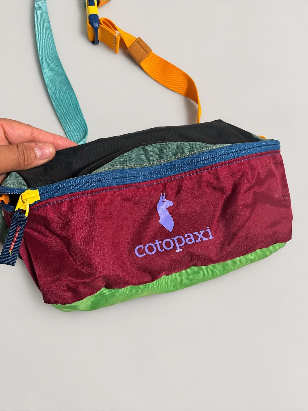 cotopaxi Burgundy and Green Men’s Waist Pack with Blue Accent